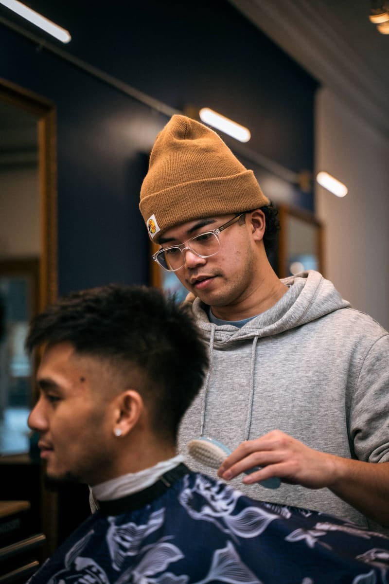 Kevin Soriano finishing a fade with a brush